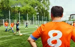 Men playing amateur friendly football match